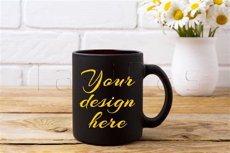 Download Black coffee mug mockup with chamomile bouquet in rustic vase.